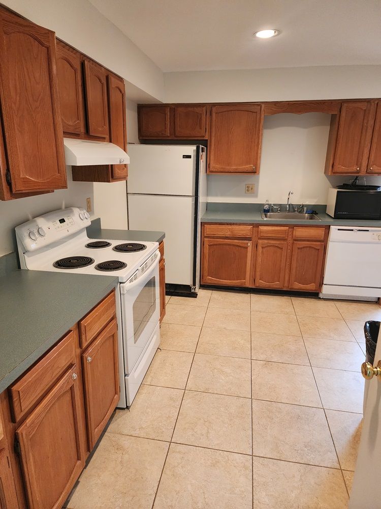 Clubhouse kitchen with stove, refrigerator, sink and dishwasher